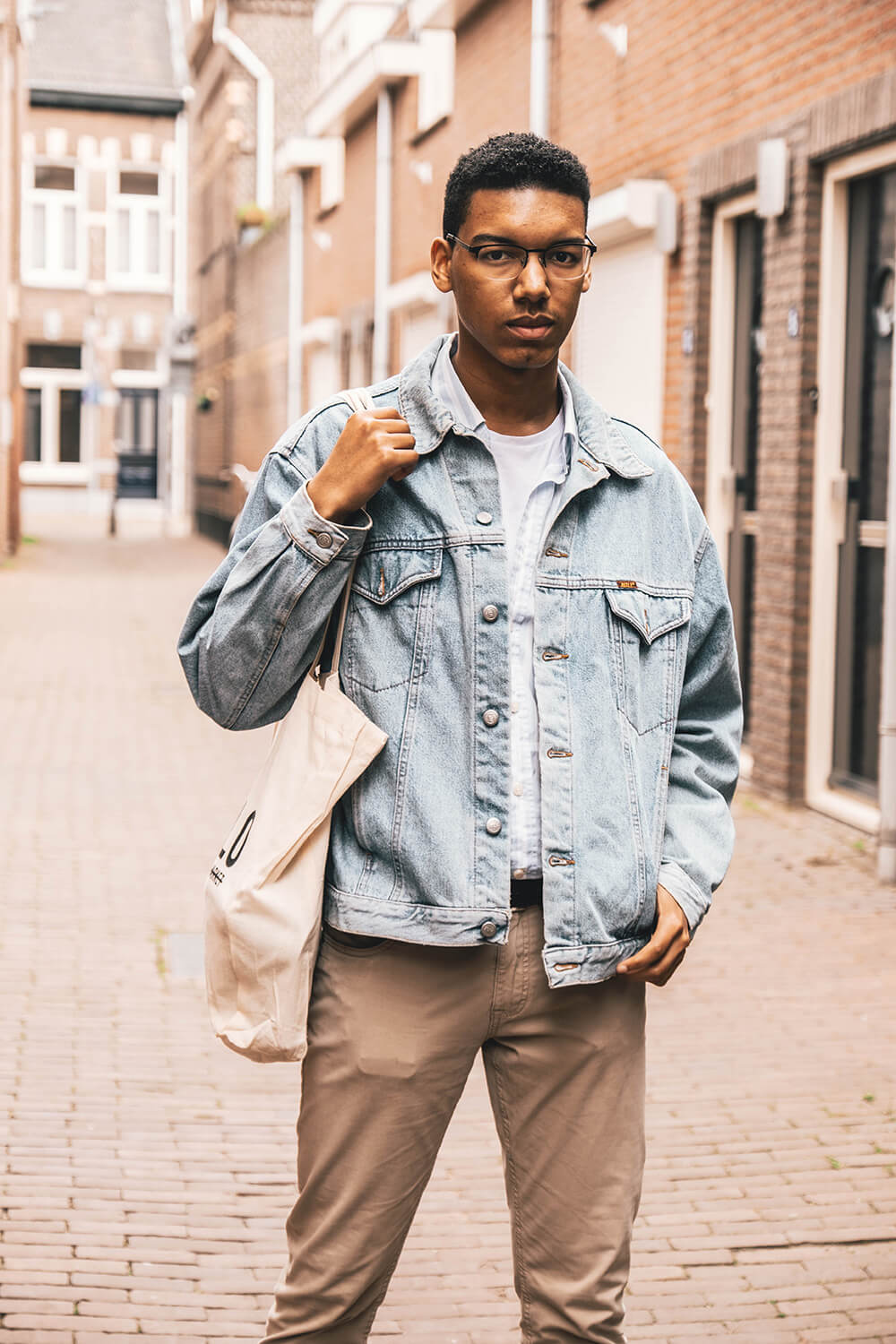 man-wearing-gray-denim-jacket