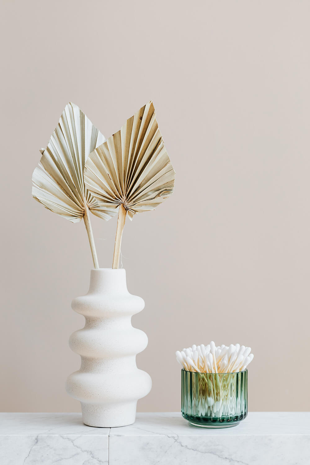 vase-with-decorative-leaves-and-container-with-cotton-buds